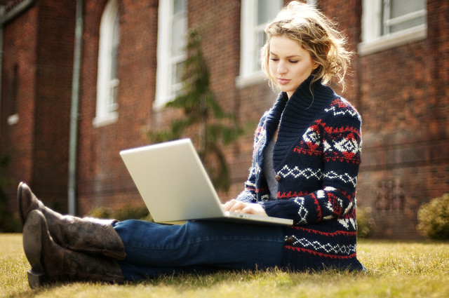 Female student working on laptop at university